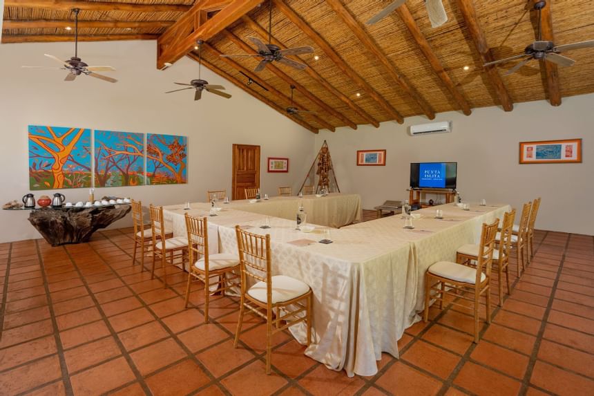 Table setting & ceiling fans in a hall at Punta Islita Hotel