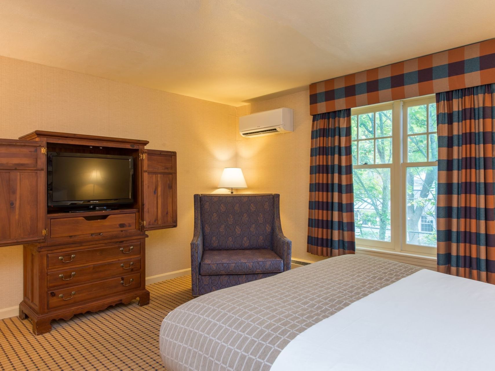 Interior of Select Queen room with a queen bed at Wolfeboro Inn