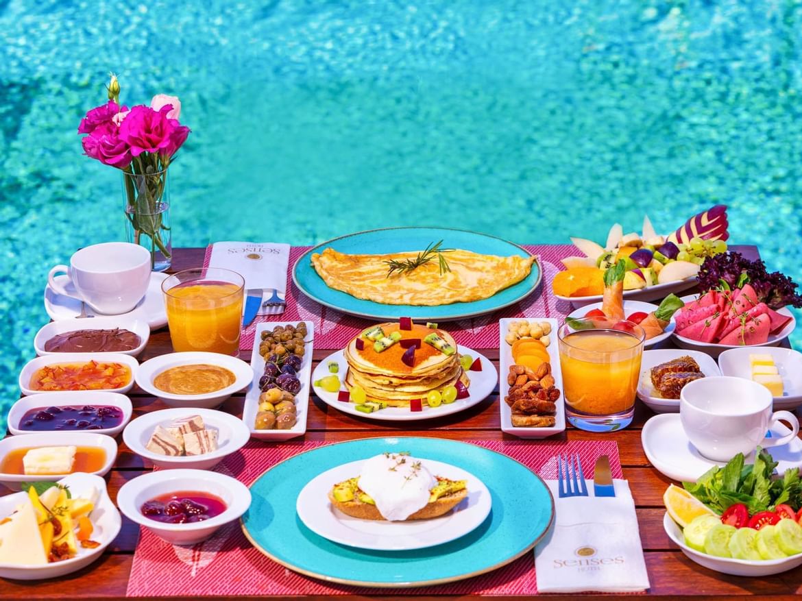 Served dishes on a table in Sitara Restaurant at Senses Hotel