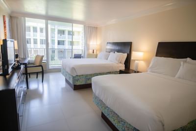 Double beds in a room with a balcony at Holiday Inn Montego Bay