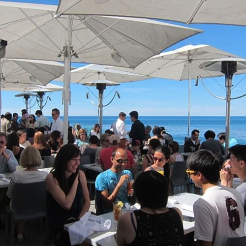 Guests at outdoor restaurant at Inn by the Sea at La Jolla