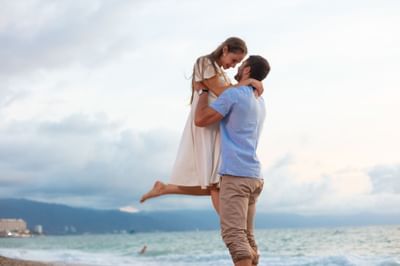Couple embracing by the sea near Villa Premiere Boutique Hotel & Romantic Getaway