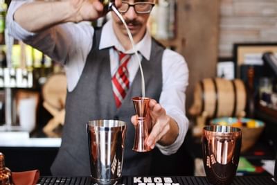 Bartender making a drink at The Paramount Hotel Portland