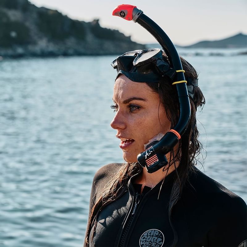 Woman wearing a diving kit at Falkensteiner Hotel Capo Boi