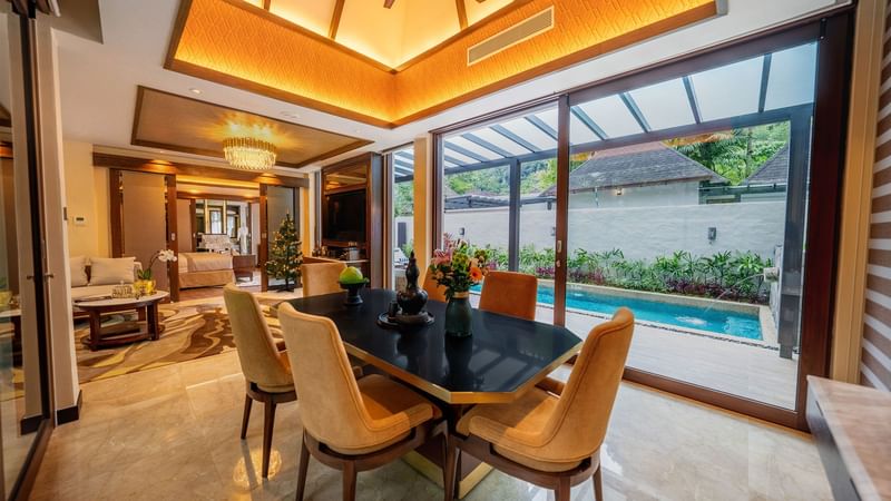 Grand Garden Villa dining room leading to a pool, and a cozy living area at The Banjaran Hotsprings