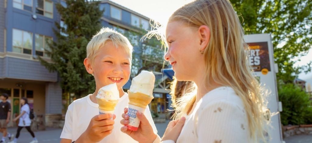 Children enjoying ice cream in Whistler Village on a summer day