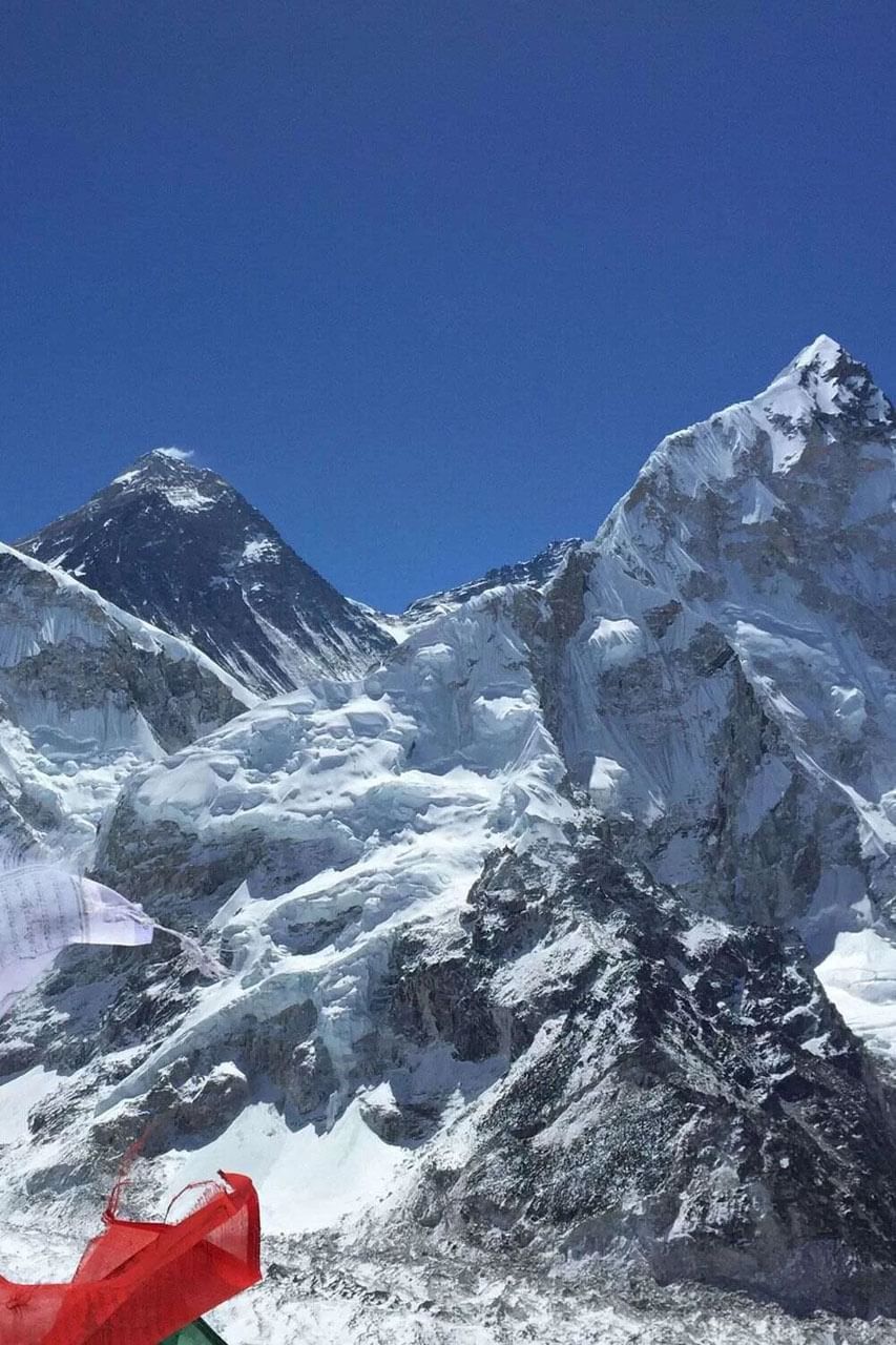 Snow-covered peaks under a clear blue sky near The Terraces Resort & Spa