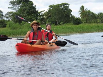 A couple Kayaking near Rio Celeste Hideaway