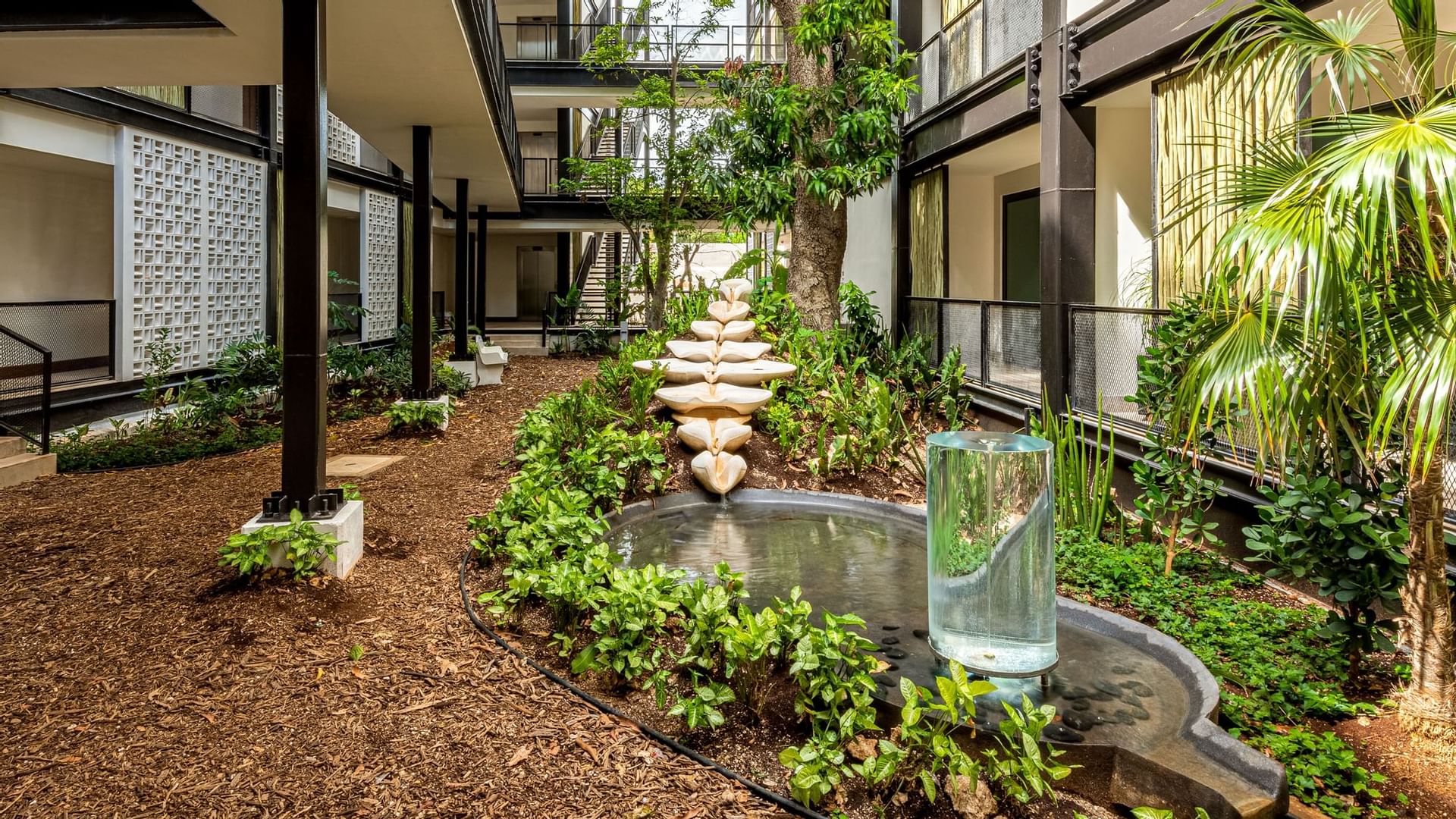 Indoor garden area with a fountain at Wayam Mundo Imperial