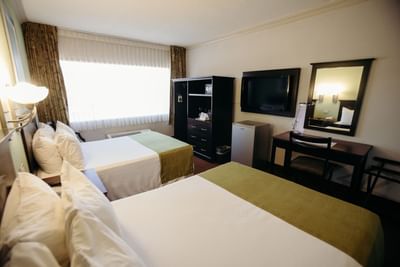 Two beds, desk & TV in Junior suite at Araiza Hotel Hermosillo