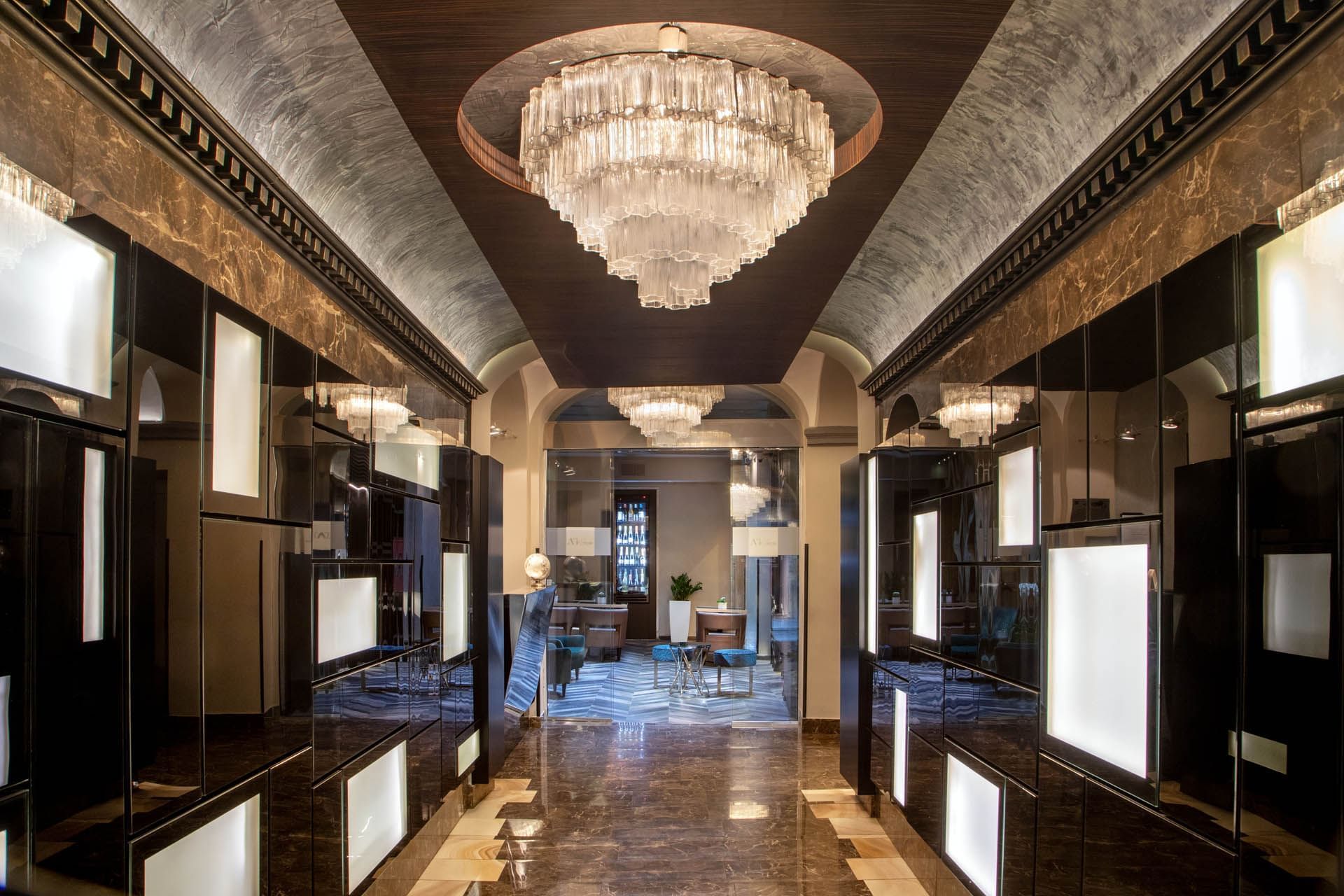 Interior of the luxurious hotel lobby with a chandelier at The Style