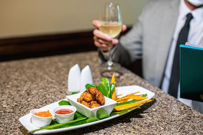 Appetizers served with wine at Jamaica Pegasus Hotel