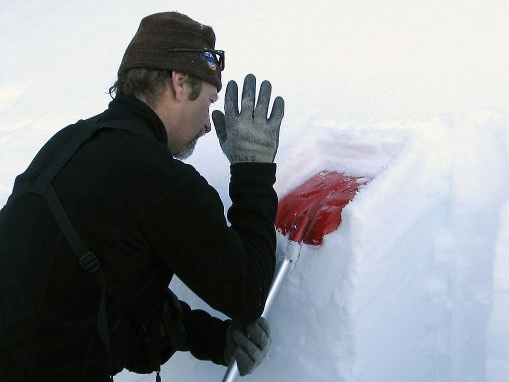 Compression test to check snowpack stability. Photo by Ruth Hartnup from Vancouver, Canada / CC BY 2.0 via Wikimedia Commons