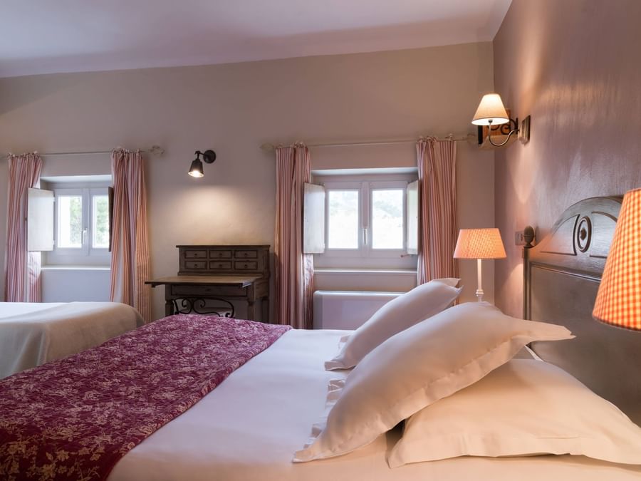 Bed & furniture in the bedroom at Hotel du Parc