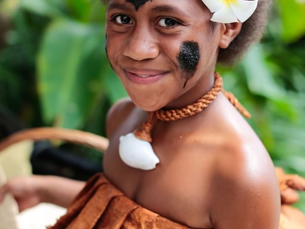 Close-up of a girl with traditional clothing at Warwick Fiji