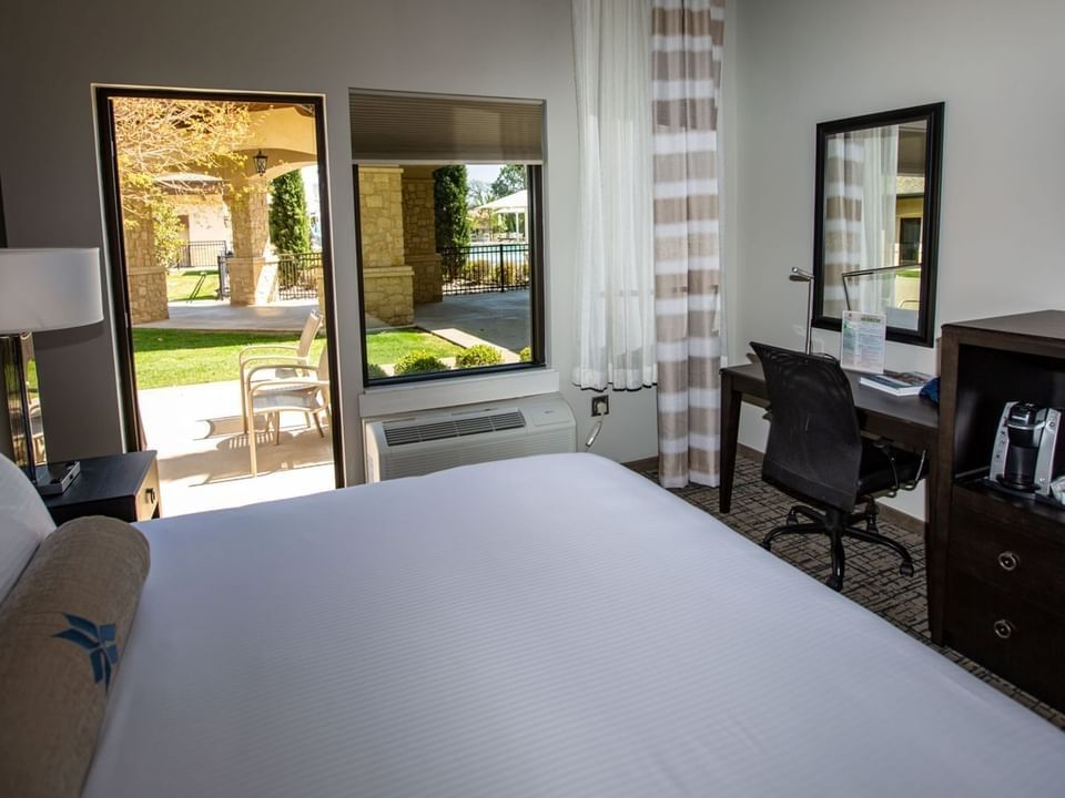 Work desk and coffee maker, facing the bed in the King Patio Room at Shangri-La Resort and Golf Club