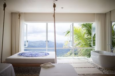 Spa room with a bathtub & mountain view at Retreat Costa Rica