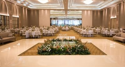 Ballroom setup for a wedding with flower deco at Ajman Hotel