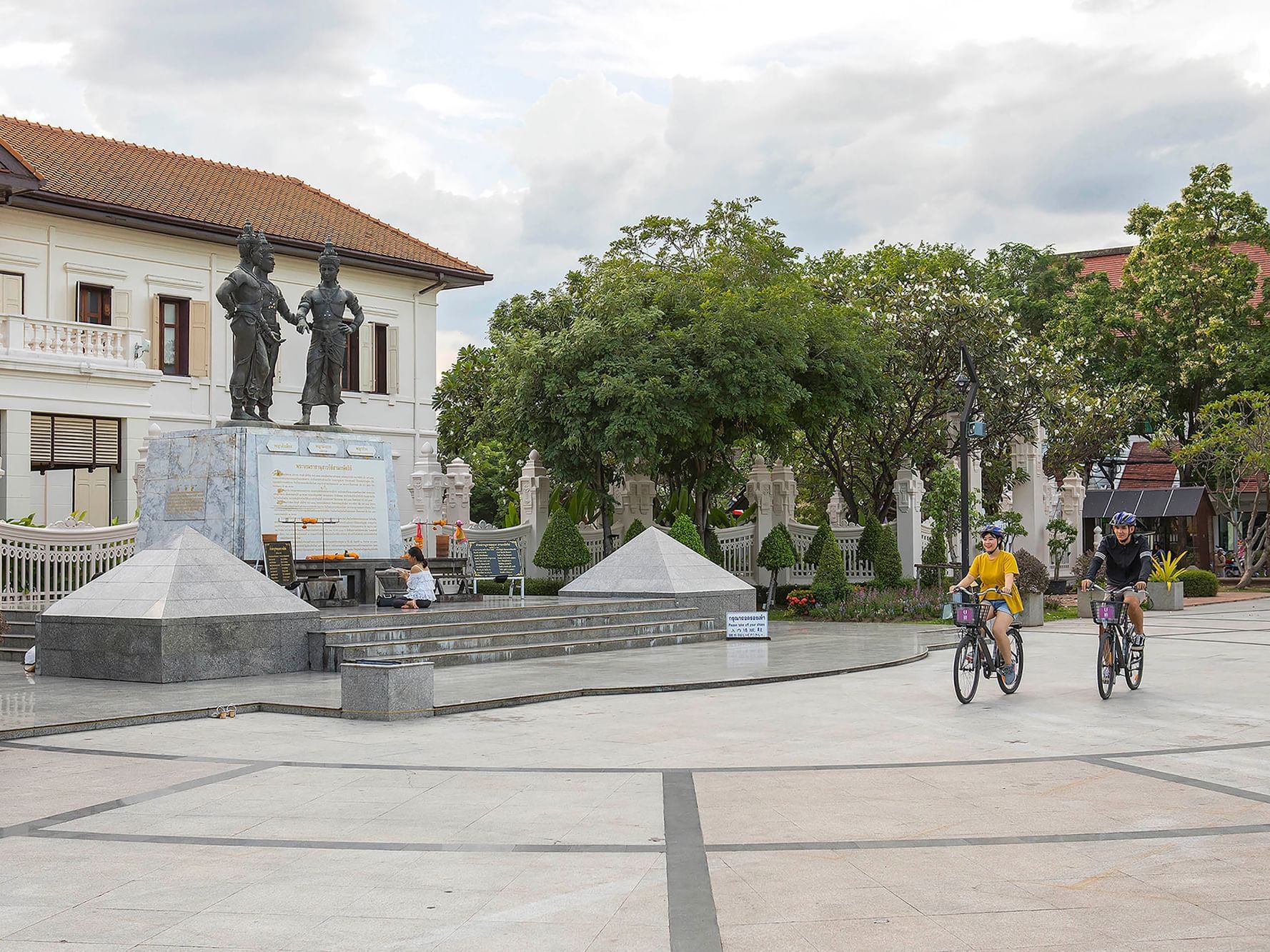 A couple riding free bikes at U Hotels and Resorts