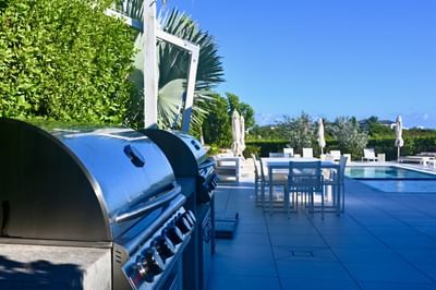 Outdoor dining area with pool at H2O Life Style Resort