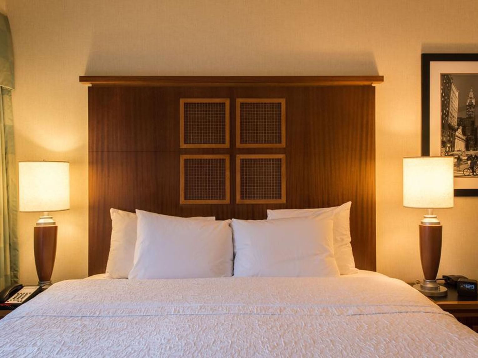 Luxurious Soho King Room at Soho 54 Hotel in NYC, featuring a plush bed with elegant lamps and decor