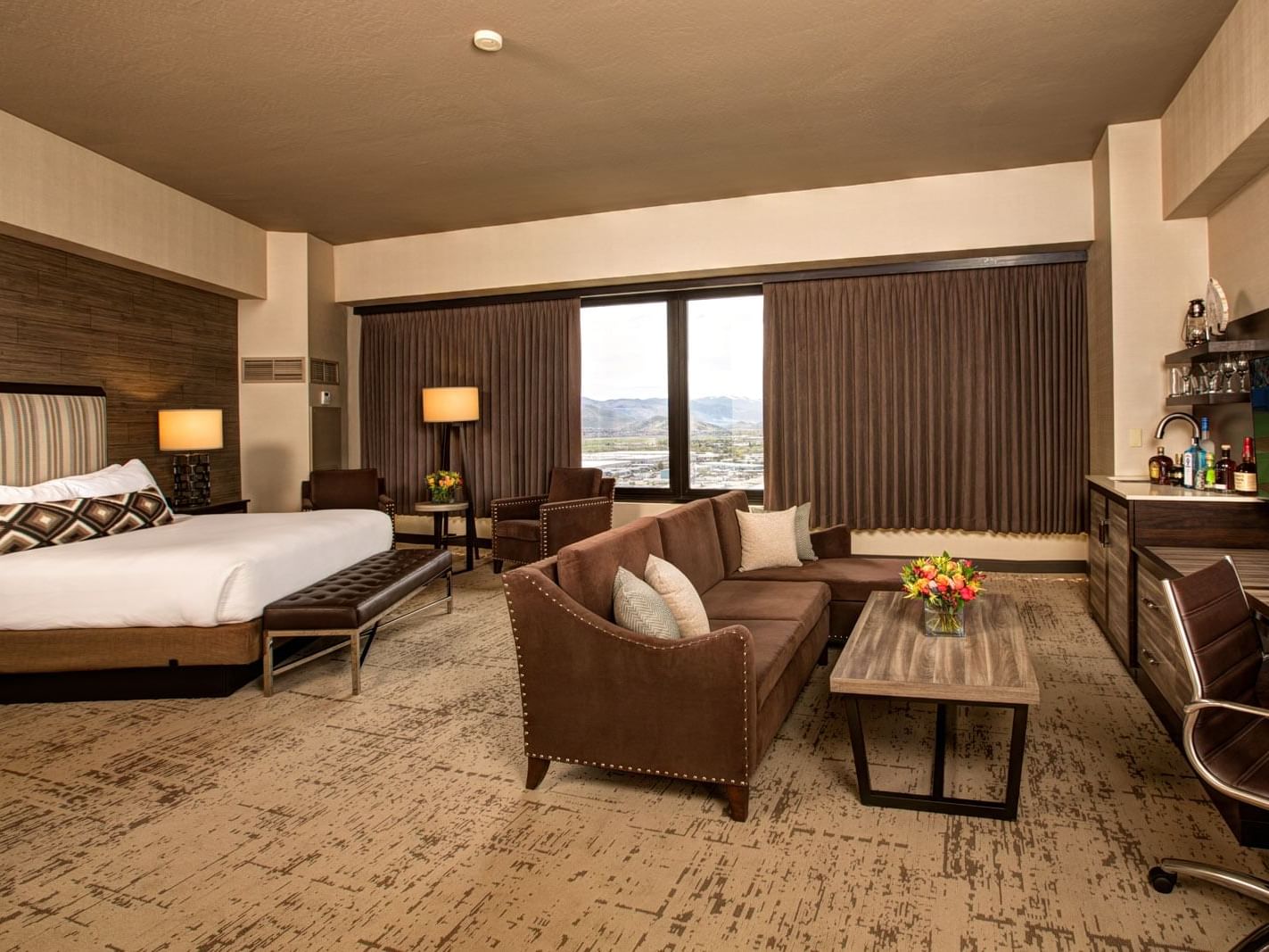 a bed and couch in a hotel room