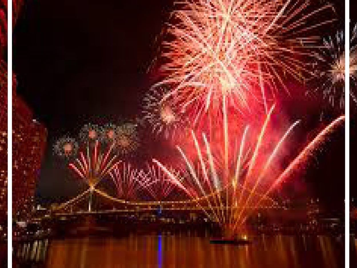 Fireworks in the sky over a bridge at night near Pullman & Mercure Brisbane King George Square