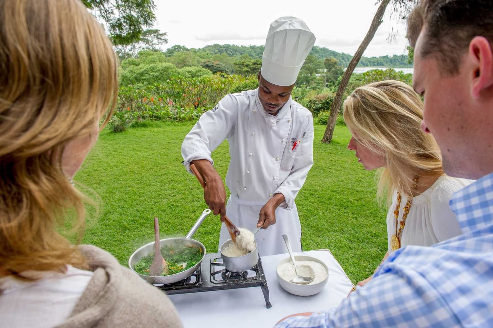 A chef Preparing a dish outdoors at Arusha Serena Hotels