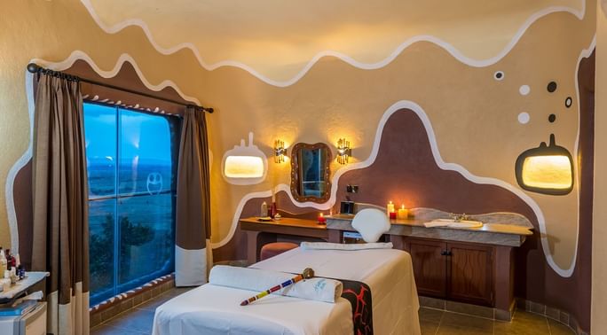 Maisha spa treatment room with bed at Mara Serena Safari Lodge
