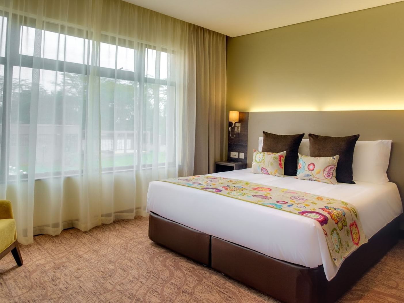 Bed in standard room at Tamarind Tree Hotel