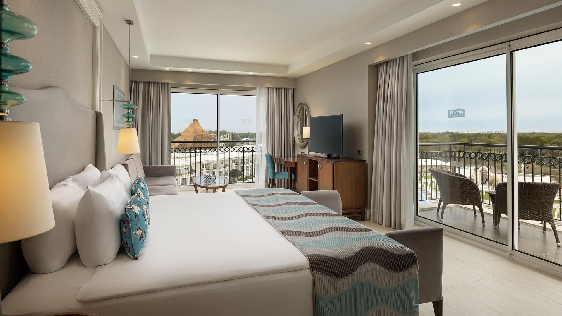 Corner Suite with balcony and spacious interior at Titanic Deluxe Golf Belek, Antalya.