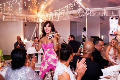 Lady playing violin in a function, Morgan Resort Spa Village