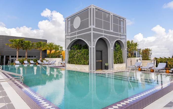 Modern pool with lounge chairs and unique pavilion at The 27 Wynwood