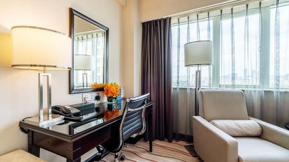 Crystal Club Room corner with a work desk, chair, lamp and city view at Park Hotel Group