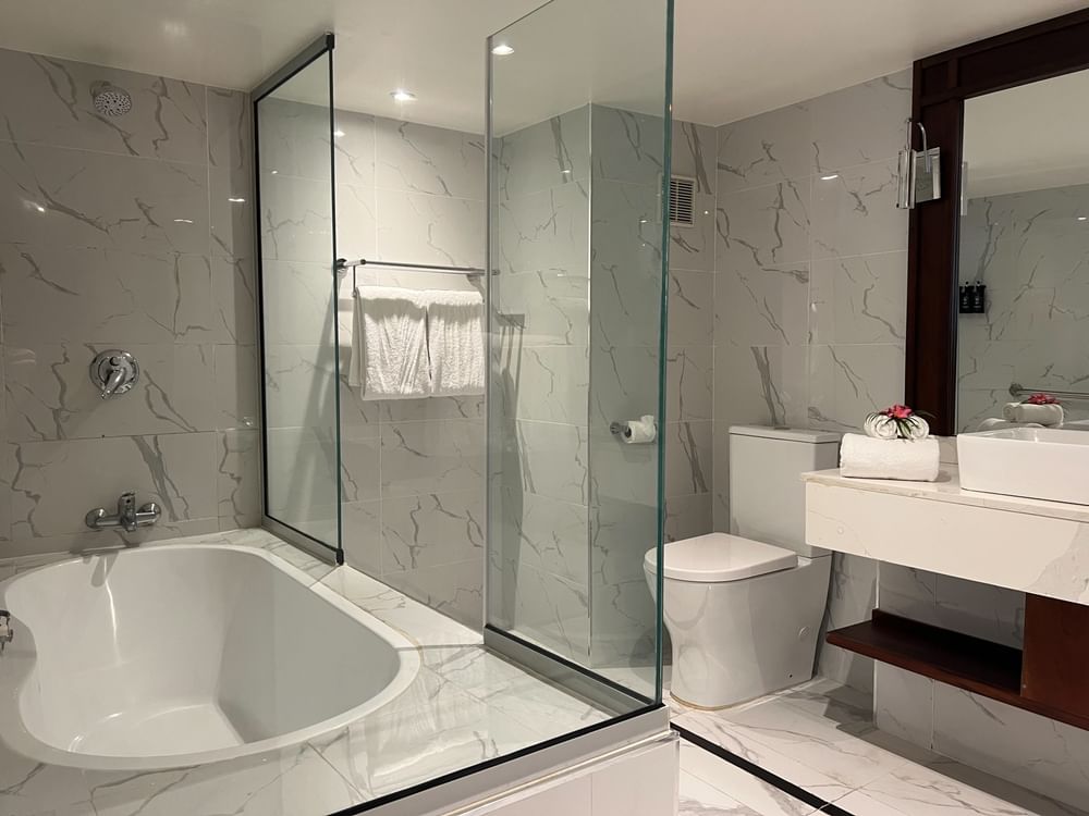 Modern bathroom with bathtub, shower, toilet, and sink at Warwick Fiji Resort and Spa in Korolevu.