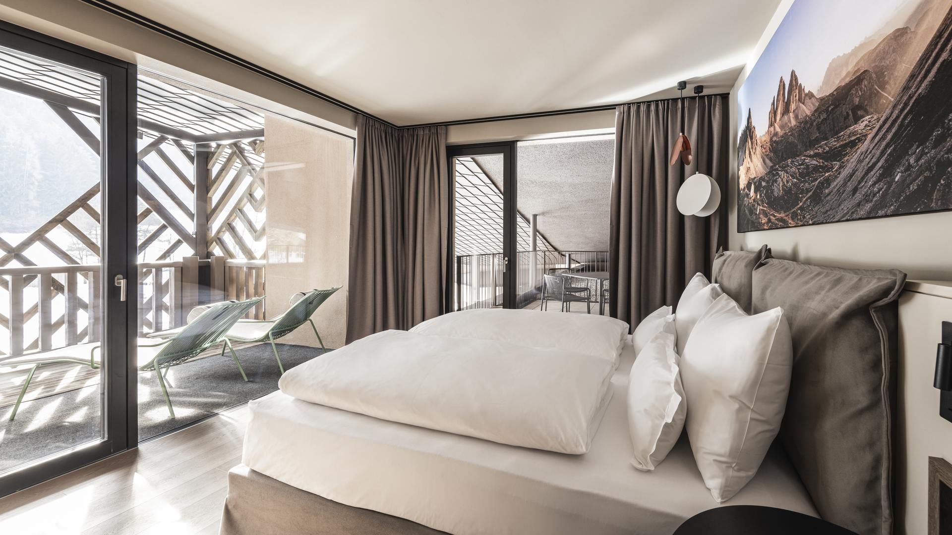 Large bed in Grand Suites Lido at Falkensteiner Hotels