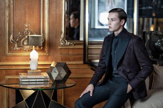 A model posing in the lobby at Patrick Hellman Schlosshotel