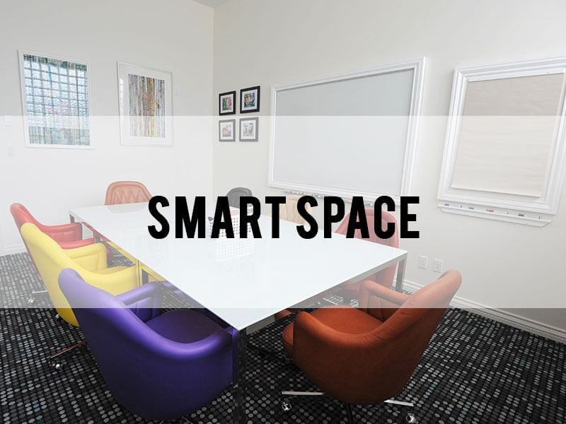 Smart workspace with a table & chairs at Retro Suites Hotel