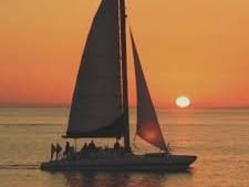 Sailboat at sunset in the sea near Shephard's Beach Resort