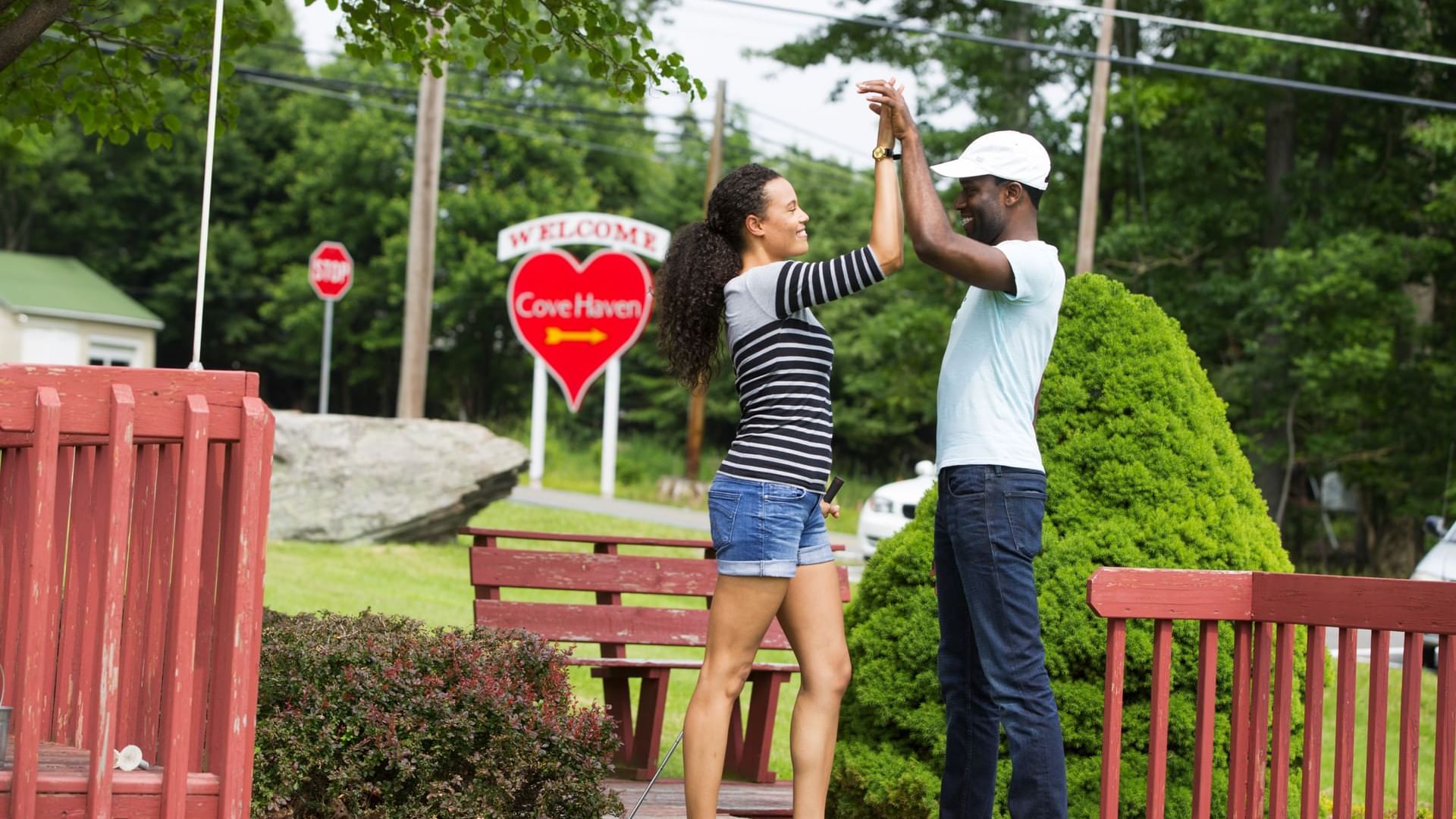 Couple embracing a win after playing Miniature Golf at Cove Pocono Resorts