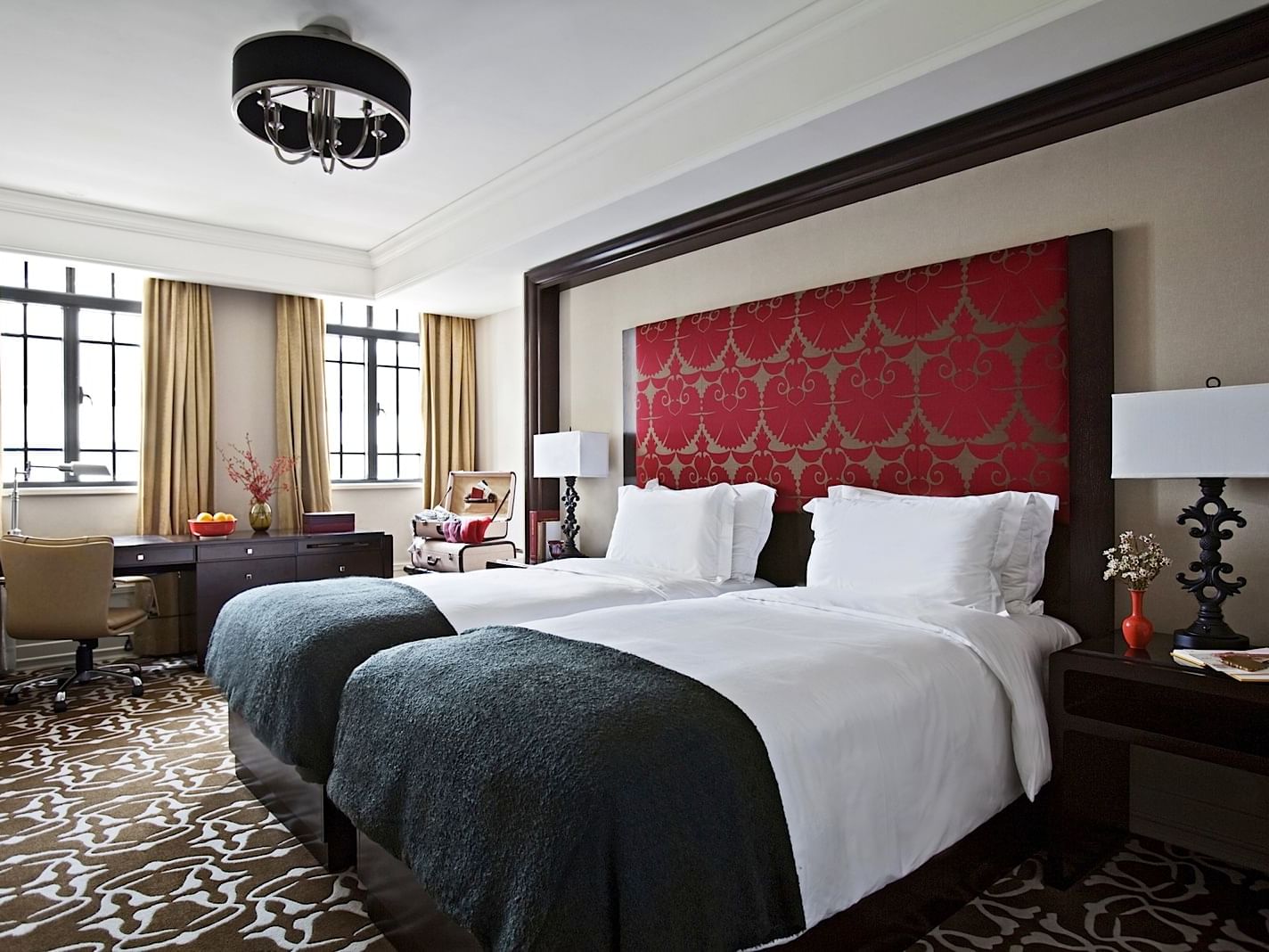 Art Deco bedroom with twin beds at Yangtze Boutique Hotel