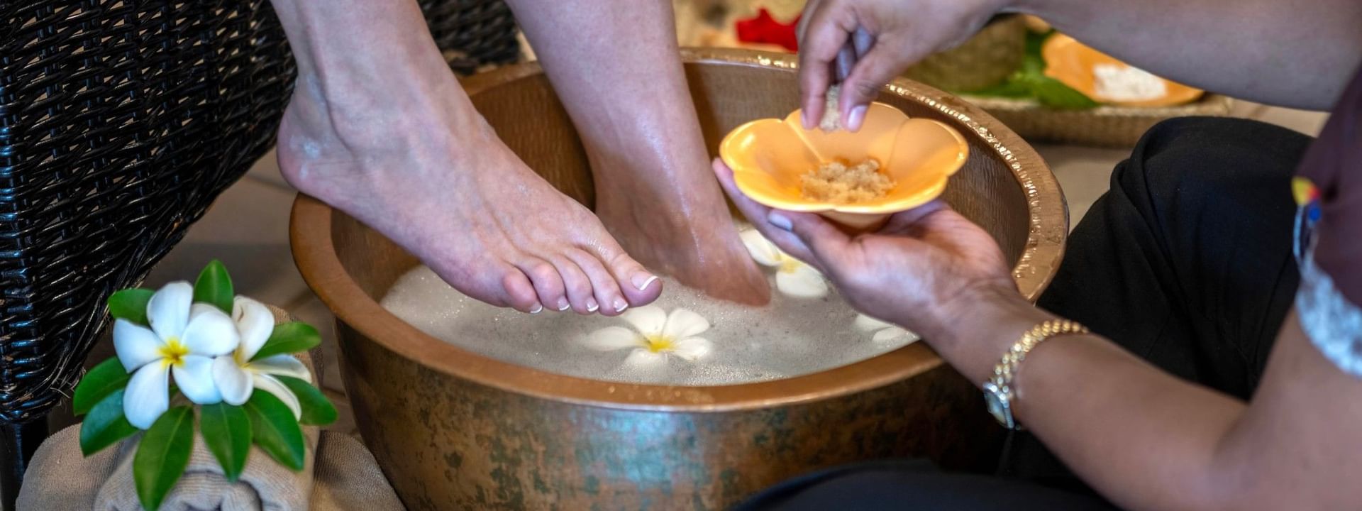 Guest receiving a foot treatment in a bowl at The Joy Spa, The Naviti Resort - Fiji