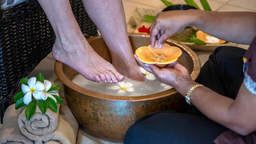 Guest receiving a foot treatment in a bowl at The Joy Spa, The Naviti Resort - Fiji.
