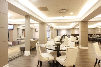 chairs and tables in a lobby area