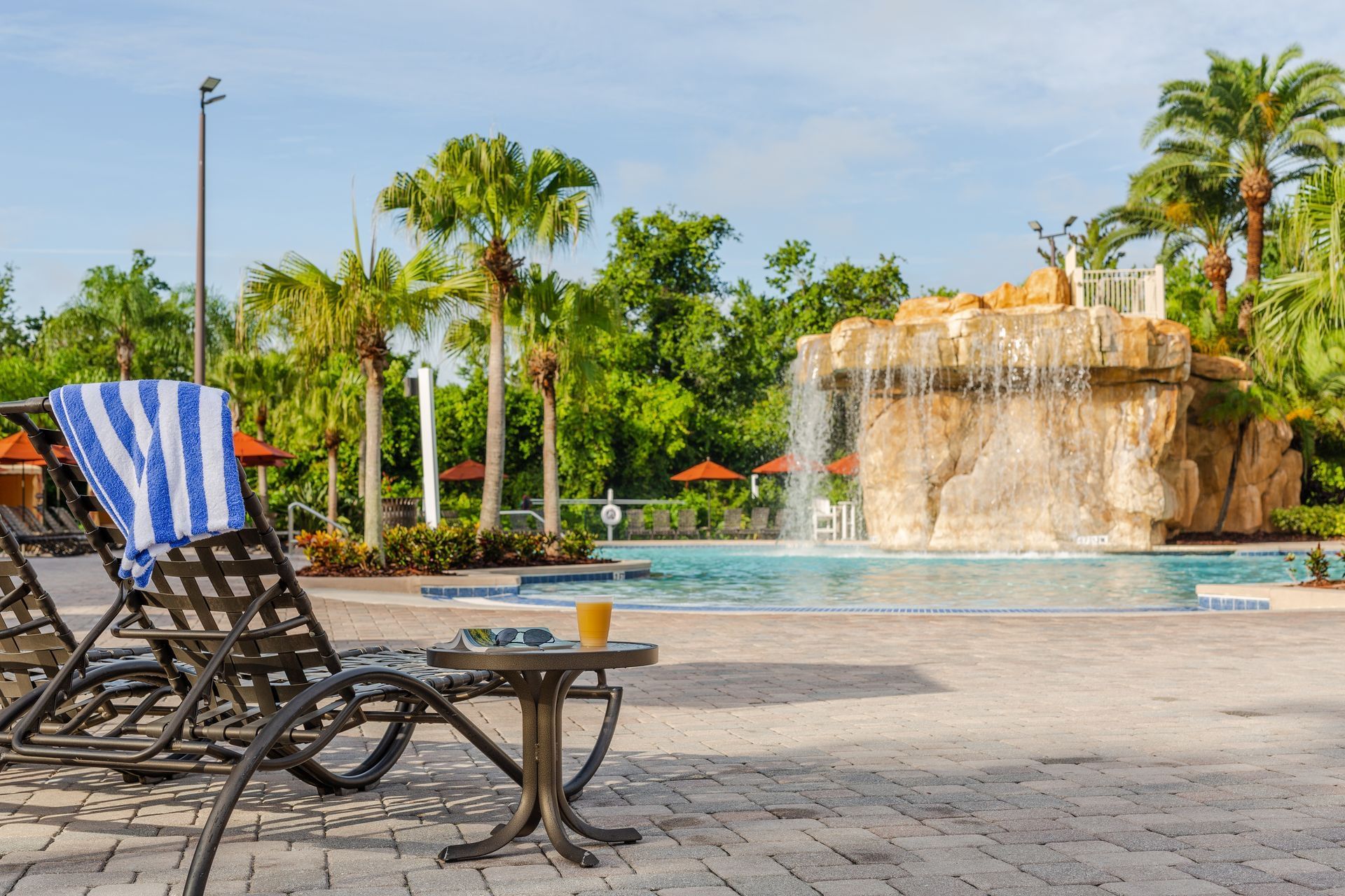 Pool area with pool chairs at Mystic Dunes Resort