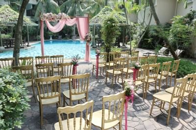 Wedding ceremony by the outdoor pool at Goodwood Park Hotel