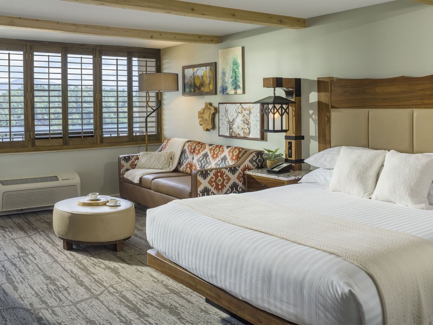 A king bed & balcony in Single View King Room at Peaks Resort