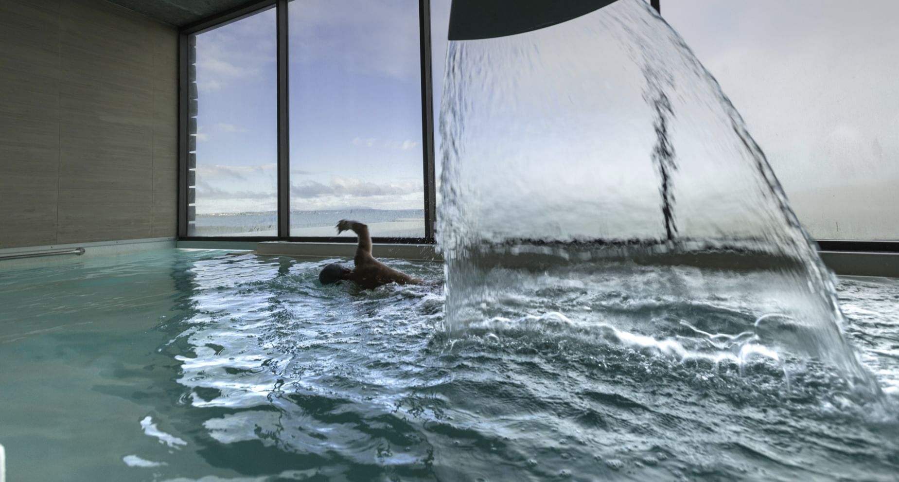 Man swimming in the pool in Spa at The Singular Patagonia
