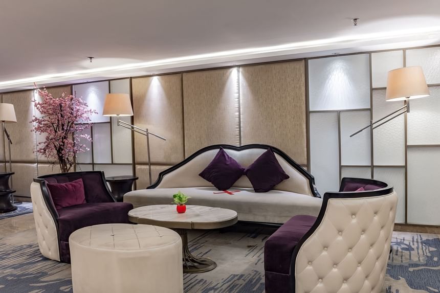 Elegant lobby featuring a large sofa and chairs in Skybar at LK Hotel Simpang Lima