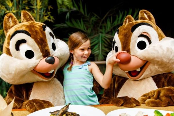 Child with Dale character mascots in Garden Grill Restaurant near Lake Buena Vista Resort Village & Spa